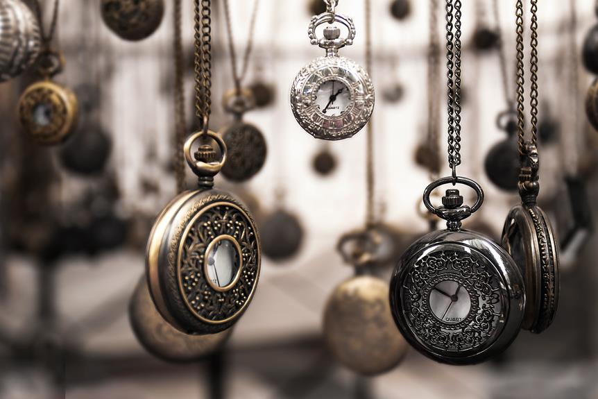 antoque fob watches hanging down on their chains illustrate the concept of antique jewelry.