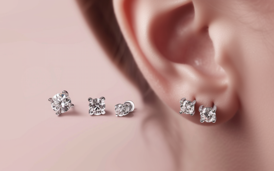 image of various diamond ear studs - beside a pair of diamond studs, drooping on an earlobe, against a soft, elegant background.